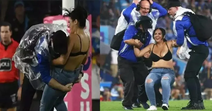 woman entered the field topless