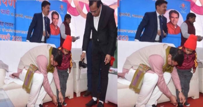 Cm dhami photo CM Dhami's photo tying the shoelaces of a little girl student went viral